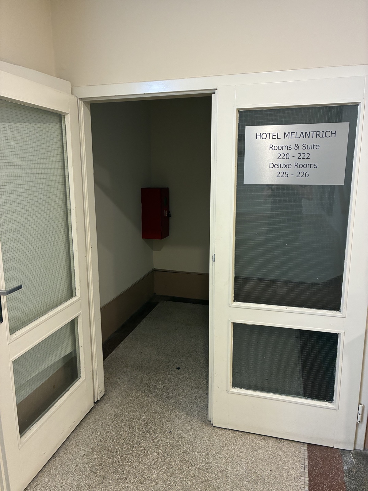 Glass door leading to rooms 220 to 226
